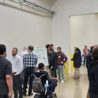 Project day attendees looking at senior projects